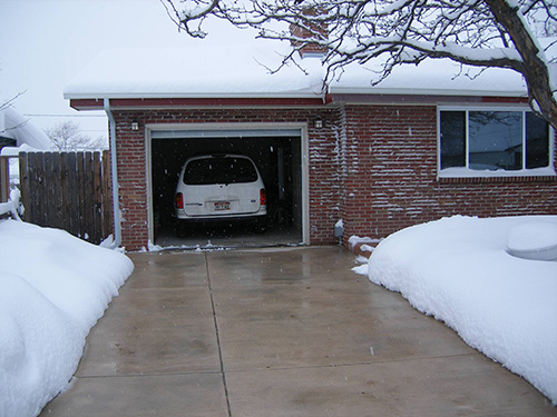 A radiant heated concrete driveway after a winter storm.